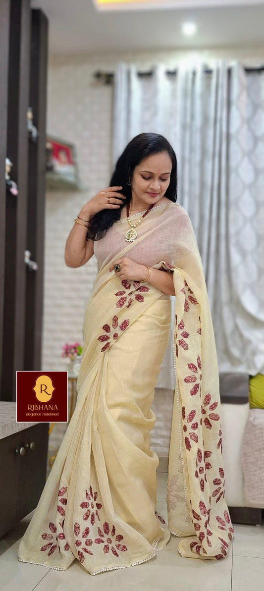 Cream colour tissue saree with pink aplic work