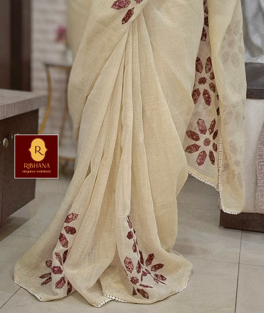 Cream colour tissue saree with pink aplic work